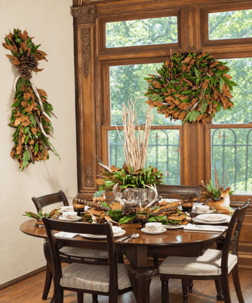 Elegant dining table set with greenery and natural decor at Weston Farms.