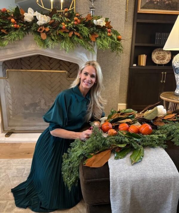Weston Farms holiday table with festive greenery and orange accents.