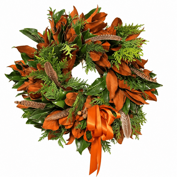 Autumn fall wreath with leaves, feathers, and orange ribbon for seasonal decor.