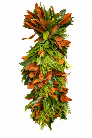 Decorative fall foliage arrangement with green and brown leaves.